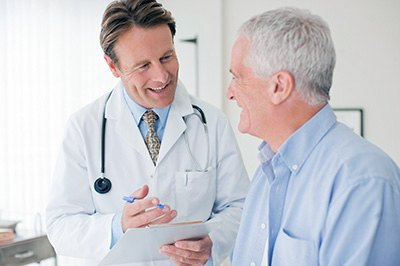 Doctor and patient smiling.